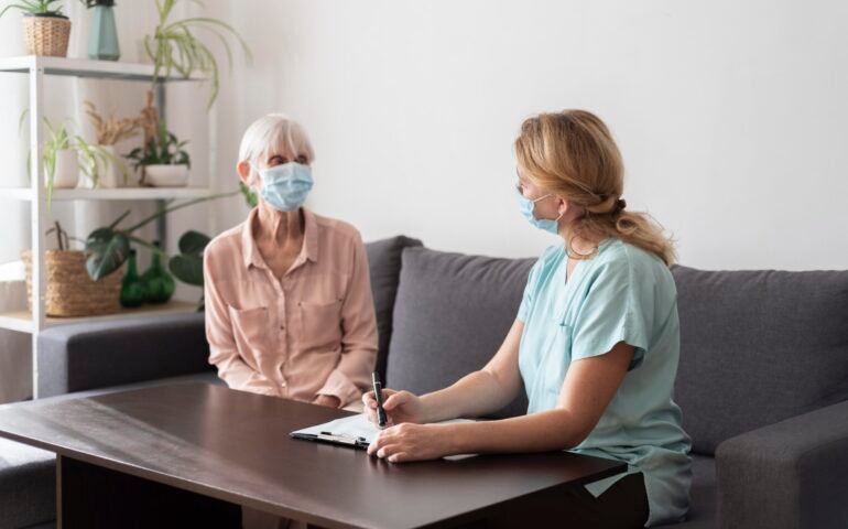 senior-woman-nursing-home-with-nurse-check-up